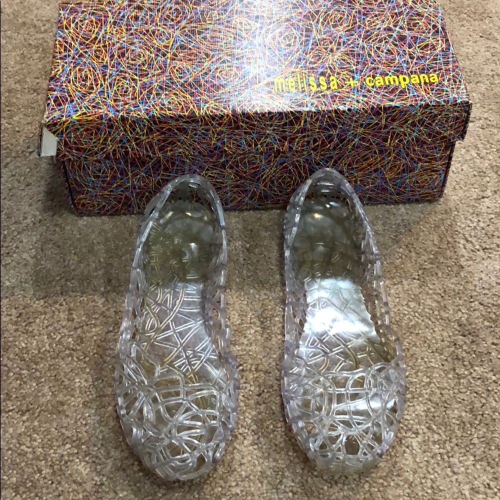 Clear rubbery size 7 Melissa + campana flats